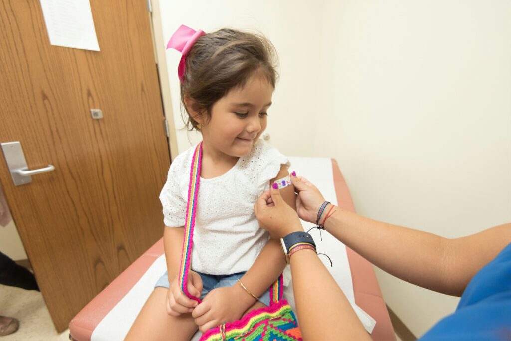 Child receiving a vaccination during a well-child visit
