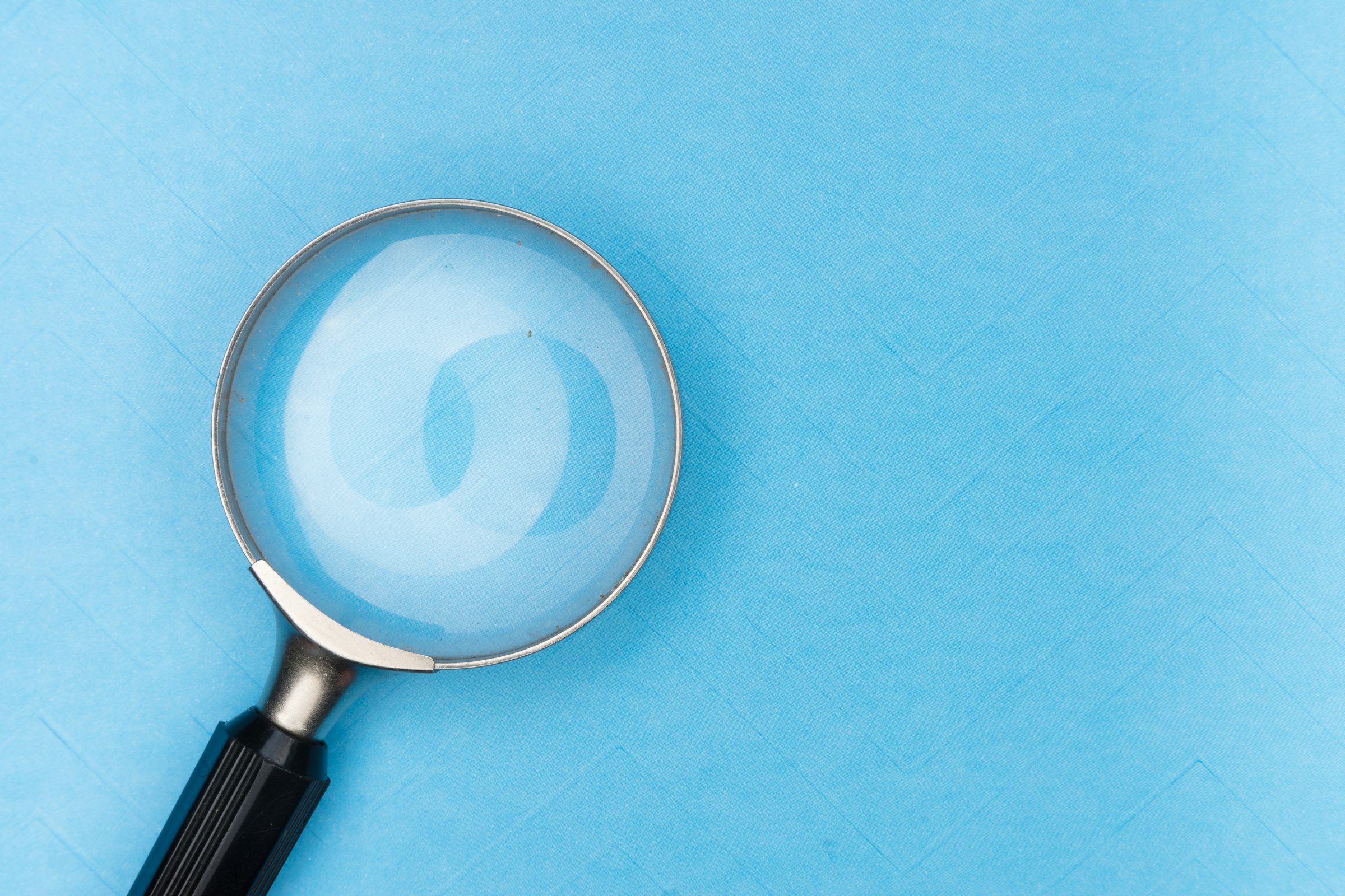 Magnifying glass representing general dermatology skin evaluations at Whitfield Family Practice in Decatur, AL